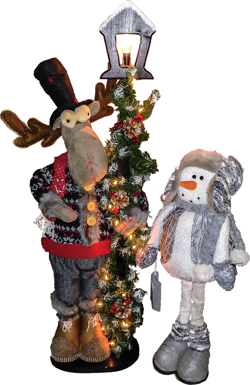 A Stuffed Animals Next To A Christmas Tree