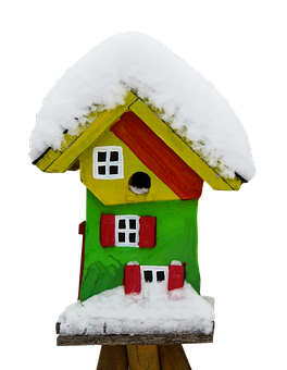 A Bird House Covered In Snow