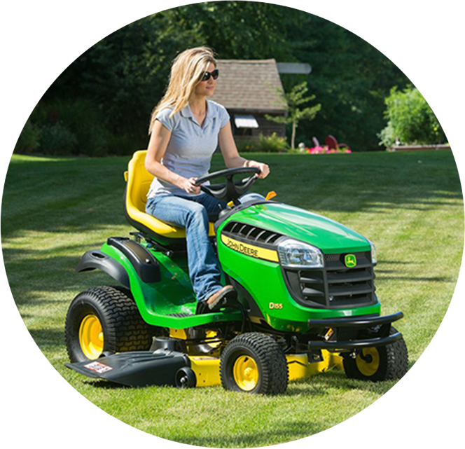 A Woman Driving A Lawn Mower
