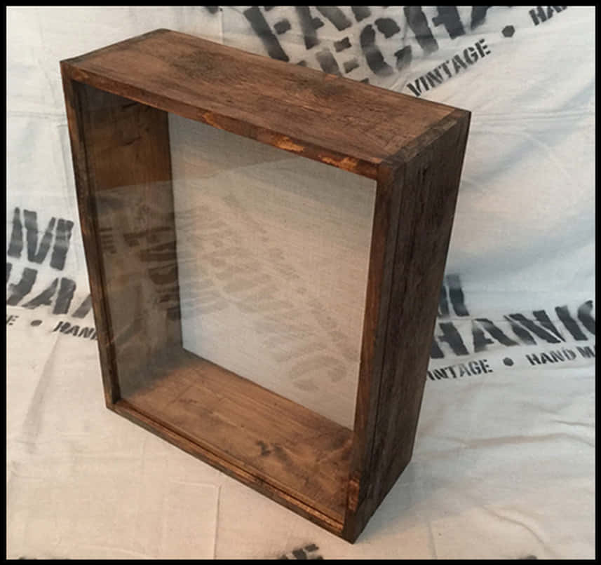 A Wooden Box With A Clear Glass Inside