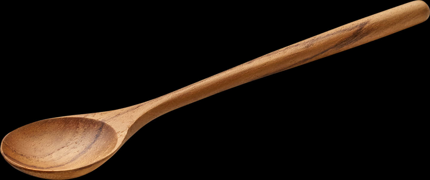 A Wooden Spoon With A Black Background