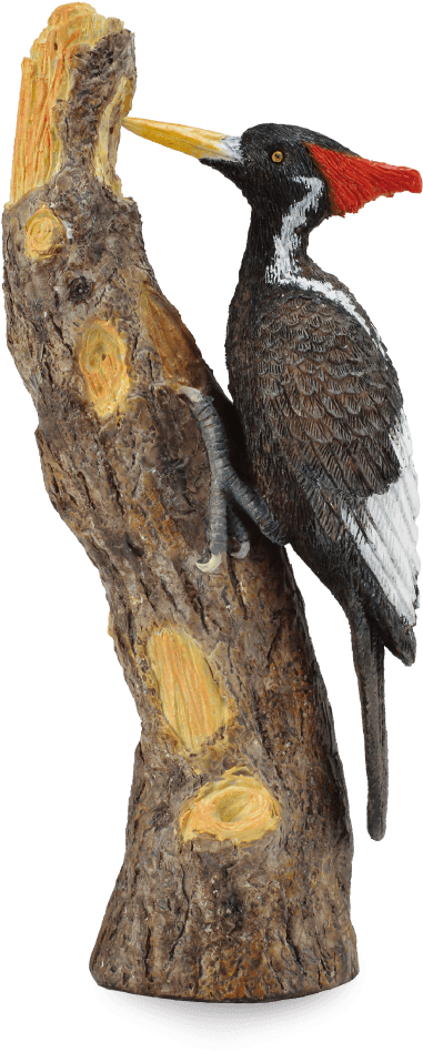 A Statue Of A Bird On A Log