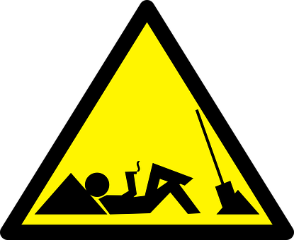 A Yellow Triangle With A Person Lying On It