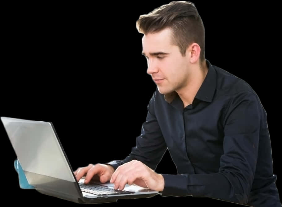 A Man In A Black Shirt Using A Laptop