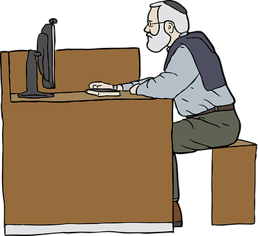 A Man Sitting At A Desk