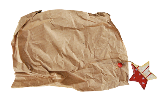 A Brown Paper Bag With A String And A Red Object
