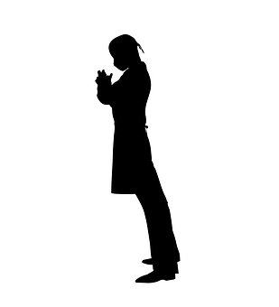 A Silhouette Of A Woman Praying